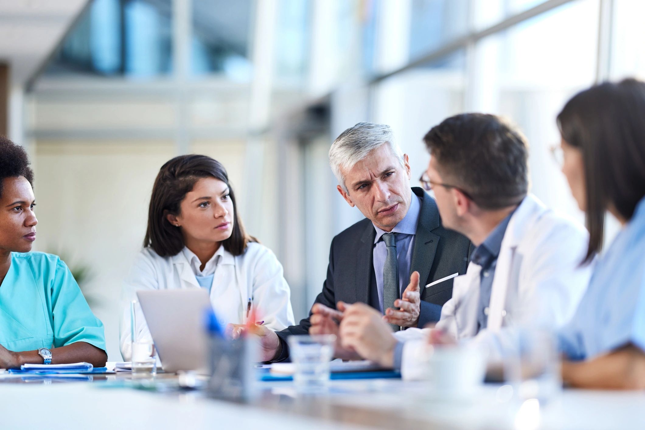 Doctors and administrator in a hospital business meeting