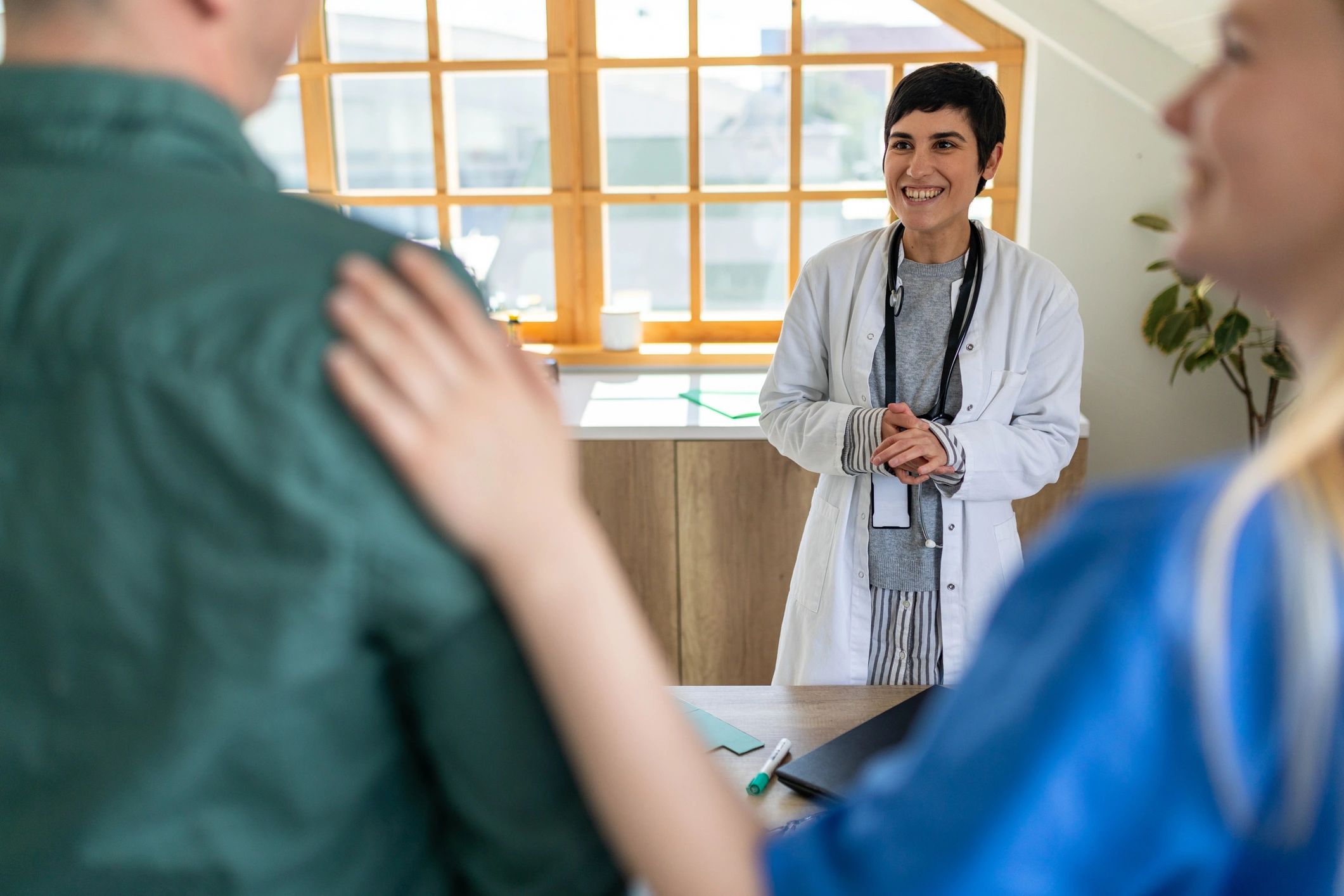Doctor, nurse, and patient in a doctor's office